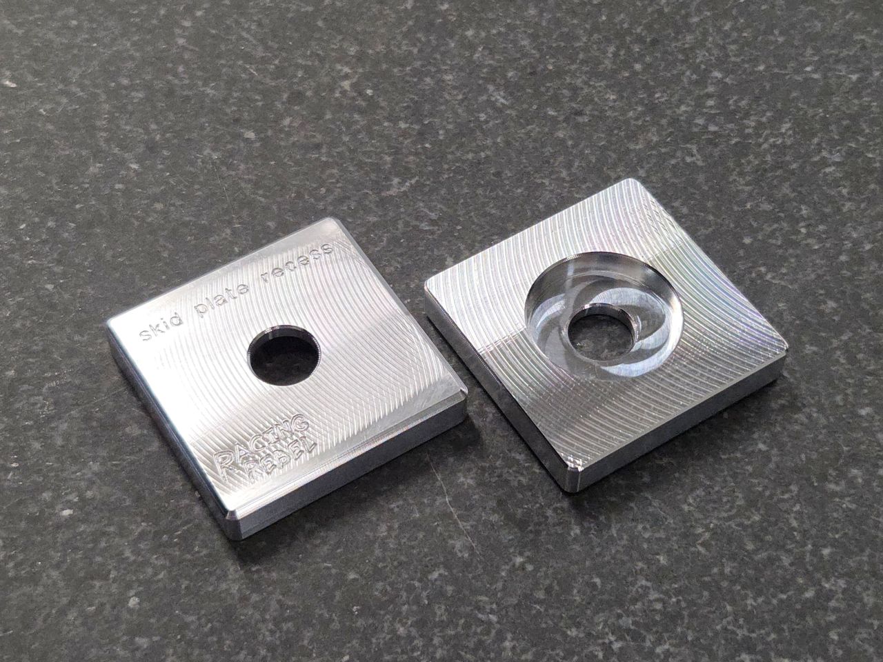 CNC machined aluminum skid plate mount with recess for off-road