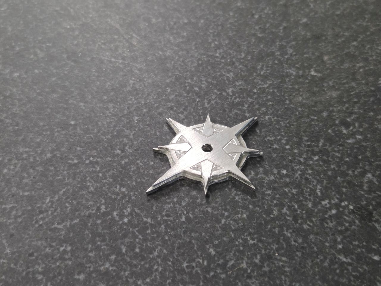 CNC machined stainless steel compass rose star for award